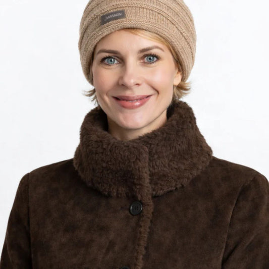 Woman in beige slouch beanie and faux fur coat